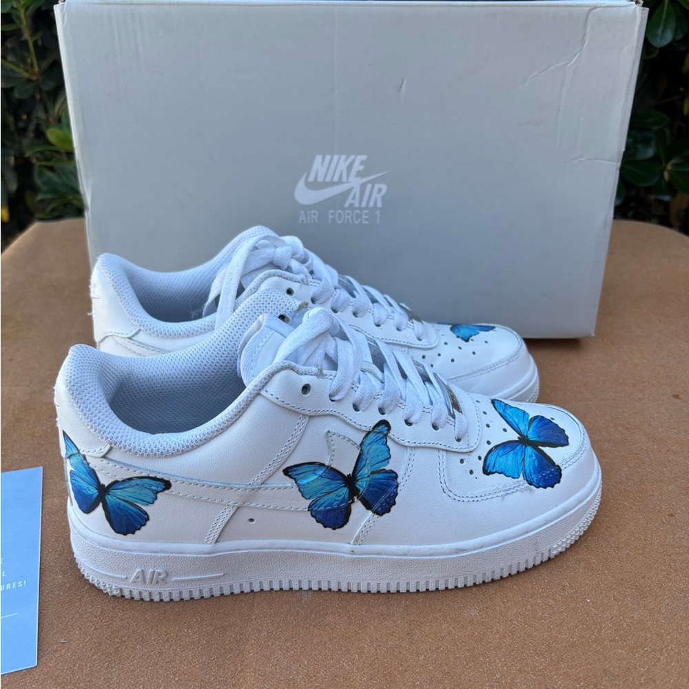 Nike Air Force 1s women 6.5 White Sneakers with Blue Butterfly Design